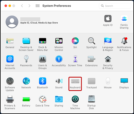 macOS System Preferences screen with Keyboard indicated